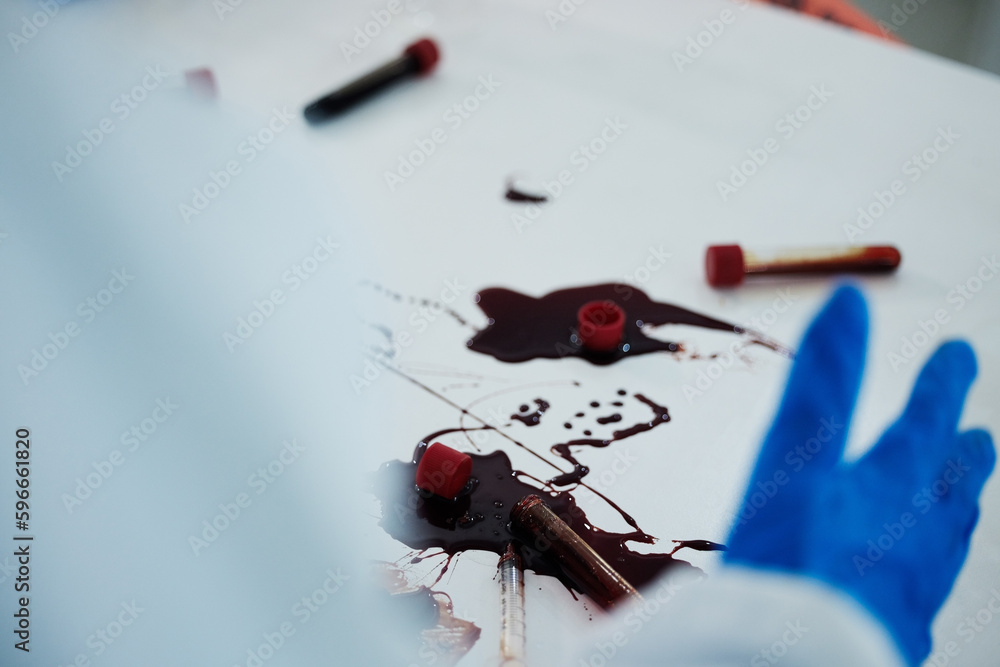 Poster Things have gotten messy. Shot of an unrecognizable scientist cleaning up a mess at a lab.