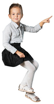 Image of cute school girl in sitting on something
