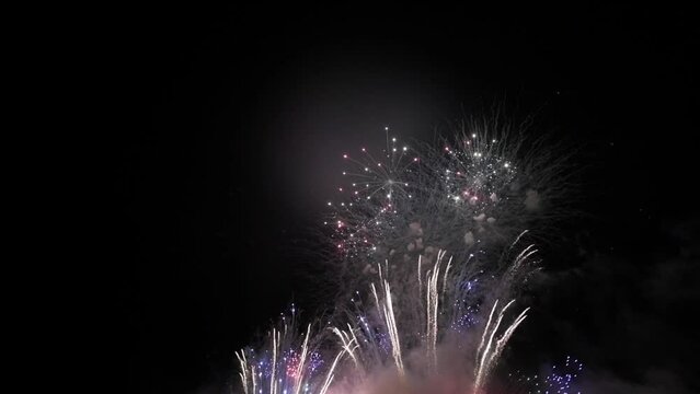 Fireworks at Night. Dark Sky and Colorful Explosion. Festival