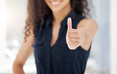 Were doing great. Shot of an unrecognizable businessperson showing a thumbs up at work.