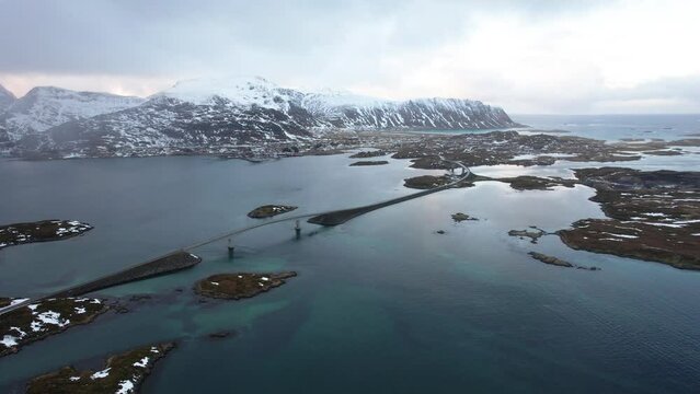 Aerial view of Lofoten Islands bridge with archipelago and mountains - Drone 4k