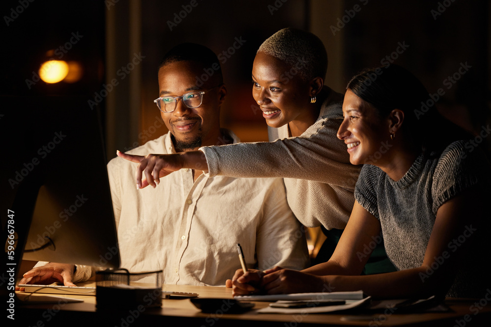 Poster The solution is right there. Shot of a group of businesspeople working together on a computer in an office at night.