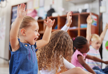 Im always excited to come to class. Shot of a group of children sitting in class. - obrazy, fototapety, plakaty