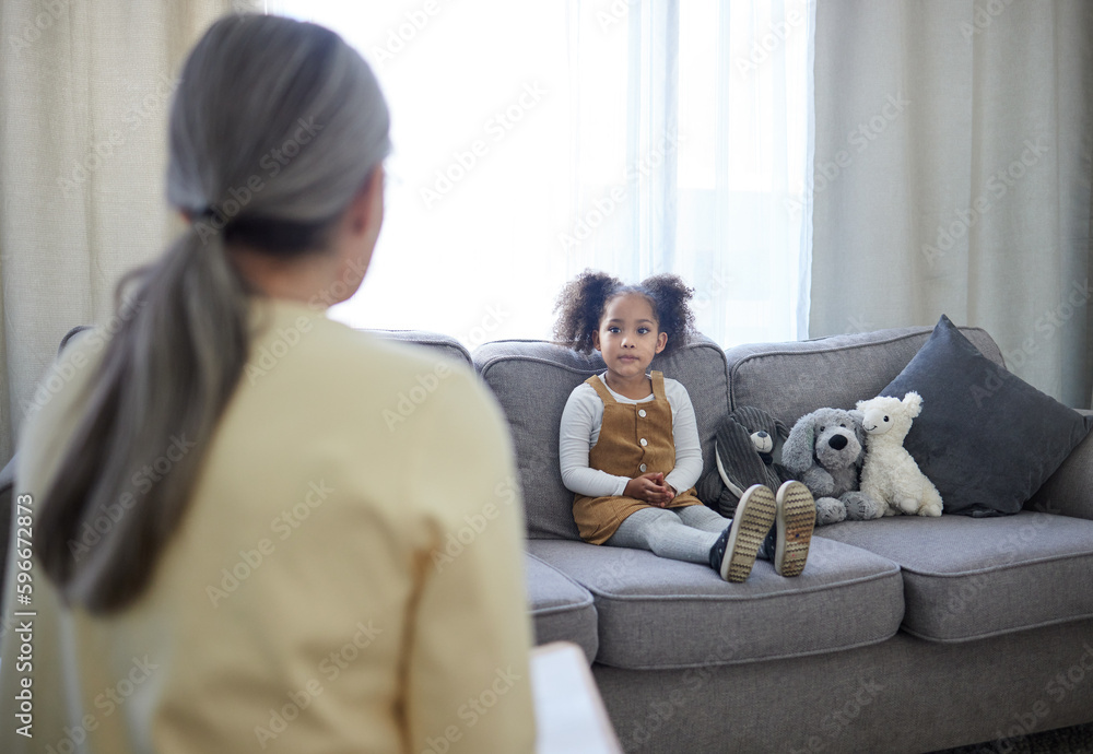 Canvas Prints You can feel safe here. Shot of a therapist speaking to her young patient.