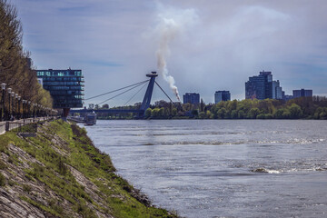 Obraz premium Distance view of so called UFO bridge on the Danube River in Bratislava city, Slovakia