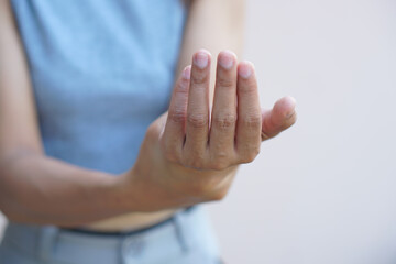 Asian woman having hand numbness