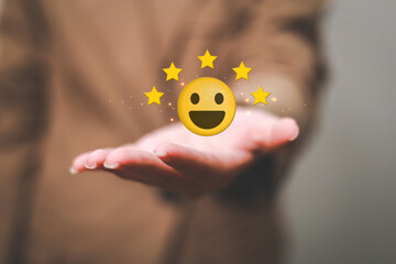 Customer pressing satisfaction with gold five star rating feedback icon and press level excellent rank for giving best score point to review the service , experience success business rate  concept.