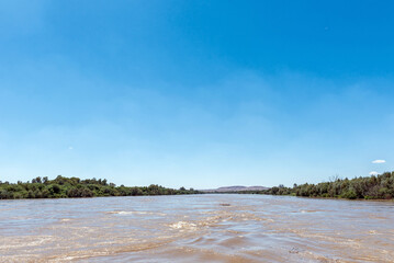 Flooded Orange River at road bridge at Grootdrink