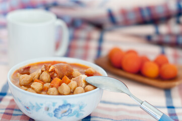 Savor the Spanish Countryside: A Hearty Bowl of Chickpea Stew with Chorizo and Aromatic Spices