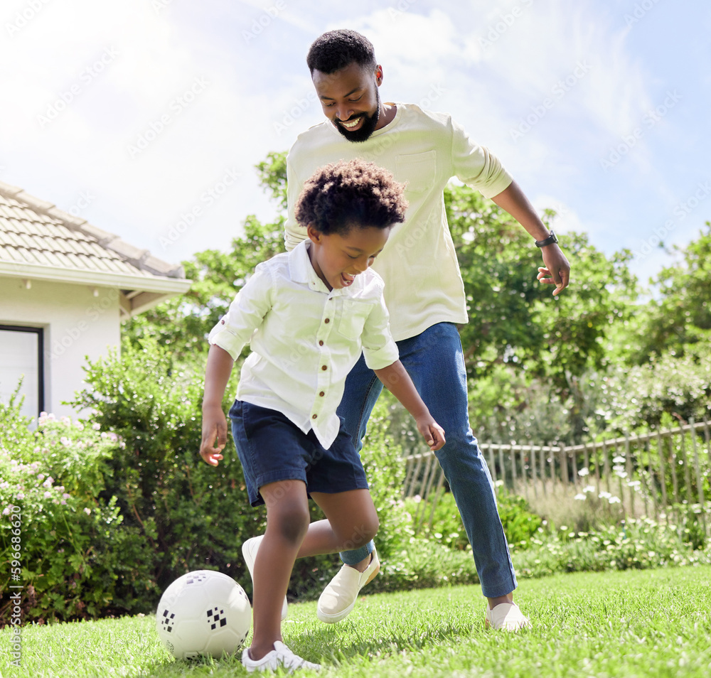 Poster They have so much energy today. Shot of a father and son playing soccer together outdoors.