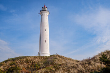Fototapeta na wymiar A Lighthouse on the Dunes of Northern Denmark at Lyngvig Fyr.
