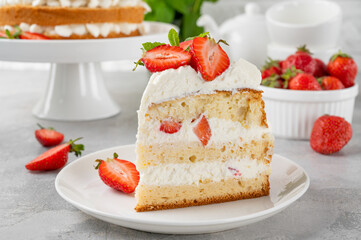 Strawberry cake, vanilla sponge cake with cream cheese and fresh strawberries. Summer cake. Selective focus.