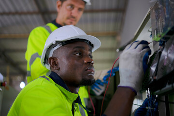 Engineer work at robotic arm factory.
