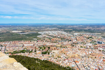 Fototapeta na wymiar Panoramic city view from Medieval castle of Santa Catalina in sunny day in Jaen, Spain on April 6, 2023