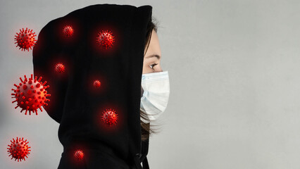 Viruses, germs, bacteria on clothes. A girl in a medical mask and a model of a flying virus.