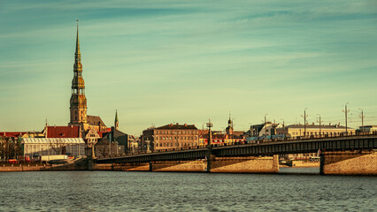 Fototapeta na wymiar Riga, Latvia - Stone Bridge over Daugava river with old town in the background