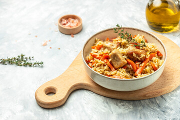 pilaf in a bowl, Uzbek dish. rice meat with vegetables. Restaurant menu, dieting, cookbook recipe top view