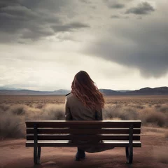 Foto op Aluminium An young woman sitting on a bench against a vast open landscape background. A.I. generated.  © JPDC