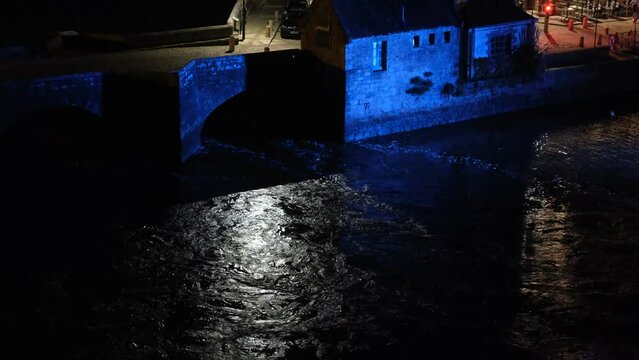 Historic Port of Saint-Goustan at Night with Blue Illumination and River Reflections Auray Brittany