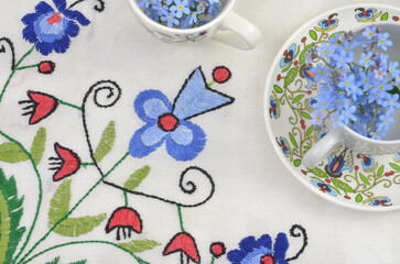 Traditional polish, kashubioan tablecloth and pattern on a cup.  - obrazy, fototapety, plakaty