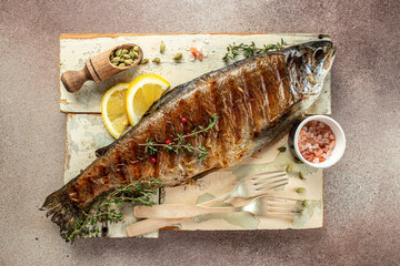 Roasted trout with lemon. Grilled trout, organic healthy products. Detox and clean diet concept