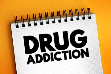 Drug addiction text on notepad, concept background