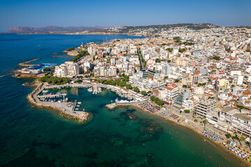 Aerial view of a busy beach in the popular resort town of Nea Chora in Chania, Crete (Greece)