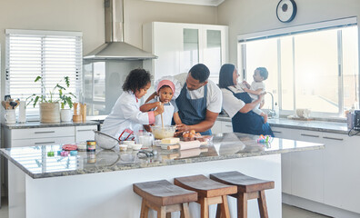 Let them help out in the kitchen because thats how they learn. Shot of a father baking at home with his two daughters.