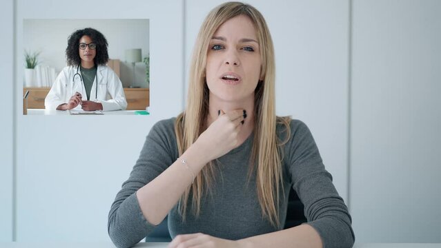 Video of beautiful woman with sore throat explains her symptoms to her doctor via video call from home