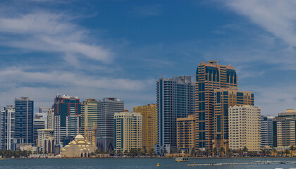 Fototapeta premium Sharjah city view, high rise buildings with lagoon