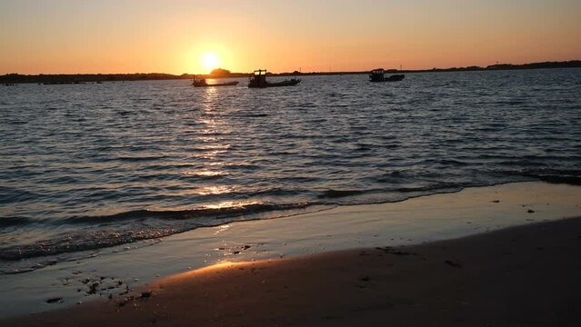 4K Fixed Shot Intense Sunset Golden Hour Over Ocean and Distant Moored Boats Carnac Morbihan