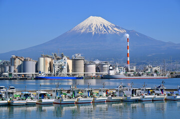 Fuji Mountain and Fisherman boats with Japan industry factory area background view from Tagonoura Fisheries Cooperative cafeteria, Fuji City, Shizuoka prefecture, Japan