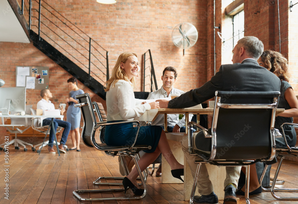 Poster Getting all the best ideas flowing. Shot of a group of businesspeople having a meeting in an office.