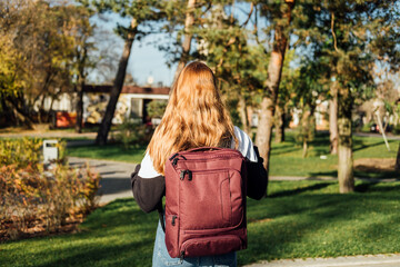Students career choice and job preparedness. Career Decisions of University Students. Back view of student girl with backpack outdoors