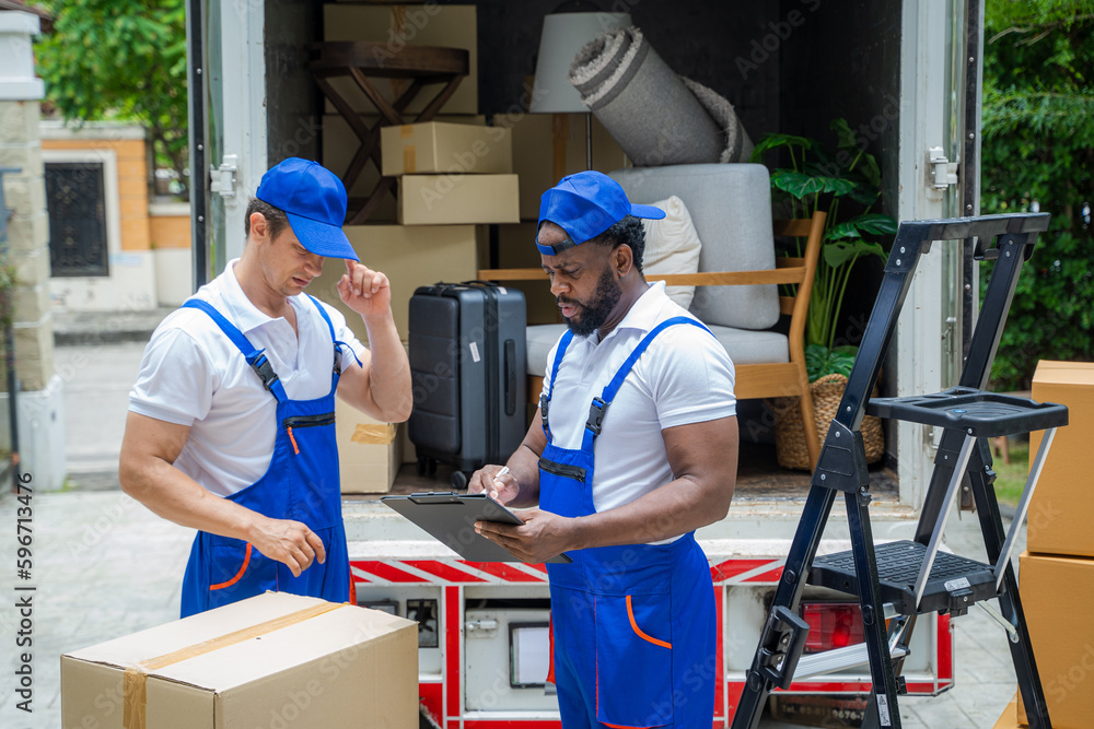 Poster Moving service workers unloading boxes and checking list,After unloading boxes from truck before sending them to the homeowner.