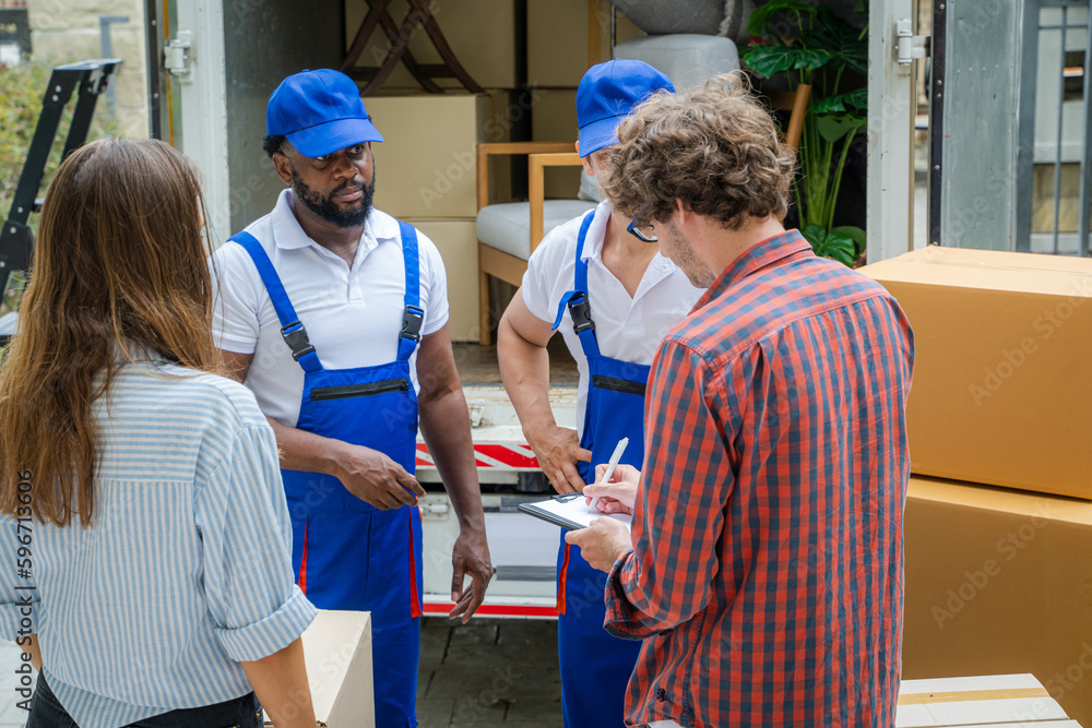 Poster house moving service,homeowner checking delivery list cardboard,moving company employee unloading bo
