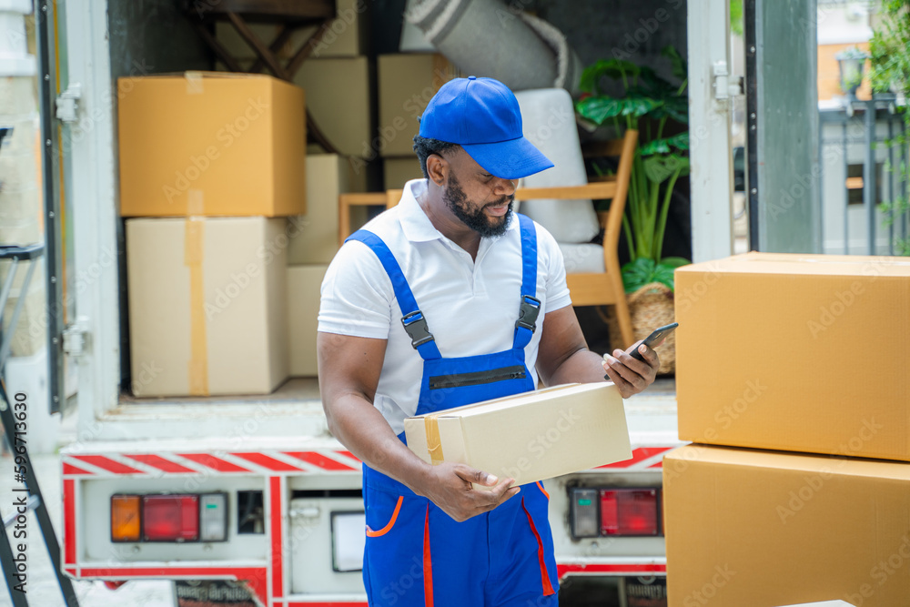 Poster Moving service workers unloading boxes and checking list,After unloading boxes from truck before sending them to the homeowner.