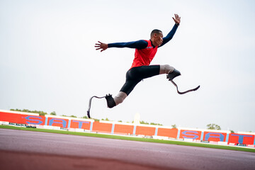 athlete runner physically disabled run on track of stadium - obrazy, fototapety, plakaty
