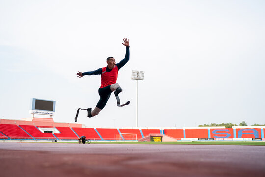 athlete runner physically disabled run on track of stadium
