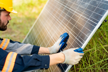 Engineer hand is installing and checking an operation of sun and cleanliness of photovoltaic solar...