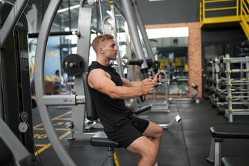 Man doing weight lifting exercises inside the gym