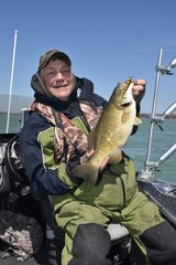 Angler with a smallmouth bass