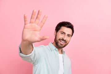 Photo of excited laughing young businessman have fun welcome wave palm high five hello friendly...