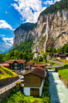 Famous Lauterbrunnen town and Staubbach waterfall, Bernese Oberland, Switzerland, Europe. Lauterbrunnen valley, Village of Lauterbrunnen, the Staubbach Fall, and the Lauterbrunnen Wall in Swiss Alps.