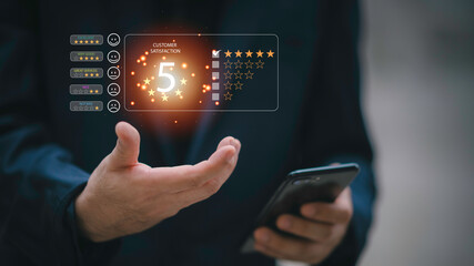 close up Man hand using computer Notebook with popup five star icon for feedback review satisfaction service, Customer service experience and business satisfaction survey.-