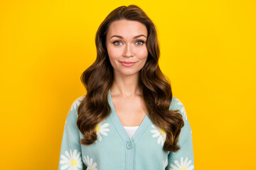 Obraz premium Portrait of satisfied friendly young lady nice wavy hairdress smile look camera isolated on yellow color background