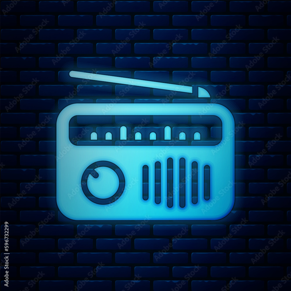 Sticker glowing neon radio with antenna icon isolated on brick wall background. vector