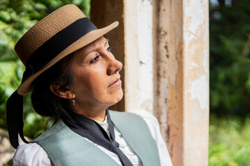 Profile portrait of Latina woman dressed in traditional clothes, looking to the side