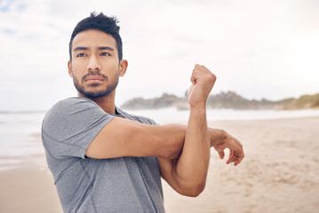 Experiencing an improved mental focus and commitment. Shot of a sporty young man stretching his...