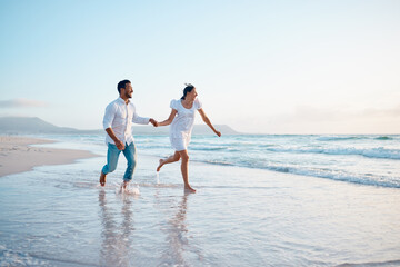 Nothing will stop us from being together. Shot of a young couple running on the beach. - Powered by Adobe
